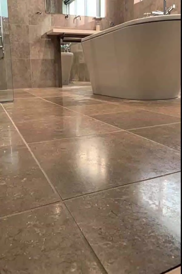 Bathroom stone floor (Stone tiles · full bathroom) — before polishing